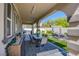 Spacious covered patio with dining area and patterned rug at 8965 S Tenaya Way, Las Vegas, NV 89113