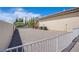 Gravel side yard with fence and AC units at 8965 S Tenaya Way, Las Vegas, NV 89113