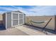 Gray storage shed and hammock in backyard at 8965 S Tenaya Way, Las Vegas, NV 89113