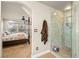 Bathroom with a large walk-in shower and view into bedroom at 9124 Ironstone Ave, Las Vegas, NV 89143