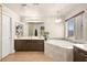 Bathroom with a soaking tub, dual vanities, and a large mirror at 9124 Ironstone Ave, Las Vegas, NV 89143