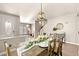 Bright dining room with farmhouse table and bench seating at 9124 Ironstone Ave, Las Vegas, NV 89143