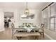 Bright dining room with farmhouse table and bench seating at 9124 Ironstone Ave, Las Vegas, NV 89143