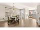 Bright dining room featuring a farmhouse table and chandelier at 9124 Ironstone Ave, Las Vegas, NV 89143