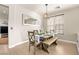 Bright dining room with farmhouse table and bench seating at 9124 Ironstone Ave, Las Vegas, NV 89143