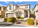 Two story home with landscaped yard and attached garage at 9124 Ironstone Ave, Las Vegas, NV 89143