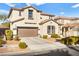 Two-story house with attached garage and landscaping at 9124 Ironstone Ave, Las Vegas, NV 89143