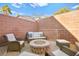 Relaxing fire pit area with wicker furniture at 9124 Ironstone Ave, Las Vegas, NV 89143