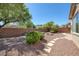 Landscaped backyard with stone pathway at 9221 Black Lake Pl, Las Vegas, NV 89178