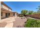 Stone patio and gravel backyard with landscaping at 9221 Black Lake Pl, Las Vegas, NV 89178