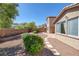 Stone patio and gravel backyard with mountain views at 9221 Black Lake Pl, Las Vegas, NV 89178