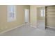 Well-lit bedroom featuring a mirrored closet and carpet at 9221 Black Lake Pl, Las Vegas, NV 89178