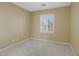 Bright bedroom with neutral walls and carpeted floor at 9221 Black Lake Pl, Las Vegas, NV 89178