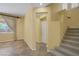 Bright entry hall with tiled floors and staircase at 9221 Black Lake Pl, Las Vegas, NV 89178