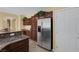 Kitchen with stainless steel refrigerator and ample wood cabinetry at 9221 Black Lake Pl, Las Vegas, NV 89178