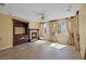 Bright living room with fireplace and built-in entertainment center at 9221 Black Lake Pl, Las Vegas, NV 89178