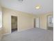 Main bedroom with carpet, walk-in closet, and en-suite bathroom at 9221 Black Lake Pl, Las Vegas, NV 89178