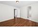 Spacious bedroom with dark brown laminate flooring and an open doorway at 9307 Bondeno St, Las Vegas, NV 89123