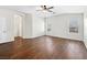 Main bedroom with two windows and dark laminate floors at 9307 Bondeno St, Las Vegas, NV 89123