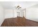 Large bedroom with ceiling fan, dark laminate flooring, and a closet at 9307 Bondeno St, Las Vegas, NV 89123