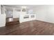 Large living room with hardwood floors, high ceilings, and a half wall at 9307 Bondeno St, Las Vegas, NV 89123