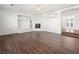 Living room with hardwood floors, built-in shelving, and fireplace at 9307 Bondeno St, Las Vegas, NV 89123