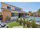 Landscaped backyard with artificial turf and pool view at 103 San Martino Pl, Henderson, NV 89011