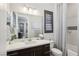 Bathroom with a vanity, toilet, shower/tub combo, and window at 103 San Martino Pl, Henderson, NV 89011