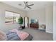 Spacious bedroom with a TV, sitting area, and large window at 103 San Martino Pl, Henderson, NV 89011