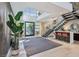 Bright entry with high ceilings, modern staircase, and stylish seating area at 103 San Martino Pl, Henderson, NV 89011