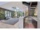Modern entry with marble-top bar, statement wall, and a floating staircase at 103 San Martino Pl, Henderson, NV 89011