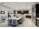 Sleek kitchen with white quartz countertops and dark wood cabinets at 103 San Martino Pl, Henderson, NV 89011
