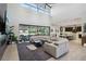 Open living space with sectional sofa, kitchen views, and high ceilings at 103 San Martino Pl, Henderson, NV 89011