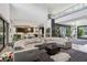 Expansive living area with sectional sofa and views into kitchen at 103 San Martino Pl, Henderson, NV 89011