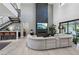 Open concept living room with sectional sofa and high ceilings at 103 San Martino Pl, Henderson, NV 89011