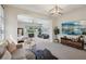 Main bedroom with sitting area, large TV, and access to private ensuite bathroom at 103 San Martino Pl, Henderson, NV 89011