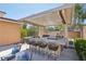 Modern outdoor kitchen with bar seating and grill at 103 San Martino Pl, Henderson, NV 89011
