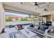 Relaxing covered patio with comfortable seating and pool view at 103 San Martino Pl, Henderson, NV 89011