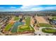 Aerial view of a golf course community with a lake at 10300 Bent Brook Pl, Las Vegas, NV 89134