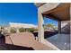 Private backyard space with low maintenance gravel, covered patio, and landscaping at 10300 Bent Brook Pl, Las Vegas, NV 89134