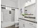 Bathroom features a sleek vanity, neutral decor, and a tub-shower combination for relaxation at 10300 Bent Brook Pl, Las Vegas, NV 89134
