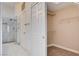 Bathroom boasts a glass shower, walk-in closet with shelving, and ceramic tile flooring at 10300 Bent Brook Pl, Las Vegas, NV 89134
