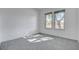 Bright bedroom with two windows and neutral carpeting offers a relaxing retreat at 10300 Bent Brook Pl, Las Vegas, NV 89134