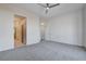 Bright and airy bedroom with soft carpet and neutral walls, featuring ensuite bath and walk in closet at 10300 Bent Brook Pl, Las Vegas, NV 89134