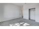 A well-lit bedroom with carpeted floors and a closet at 10300 Bent Brook Pl, Las Vegas, NV 89134
