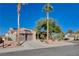 Charming home with a two-car garage, palm trees, desert landscaping, and a well-manicured front yard at 10300 Bent Brook Pl, Las Vegas, NV 89134
