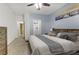 King sized bed in spacious Primary bedroom with access to bathroom and closet at 113 Emerald Forest St # 203, Las Vegas, NV 89145