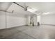 Spacious garage with epoxy flooring and overhead storage at 11333 Hedgemont Ave, Las Vegas, NV 89138