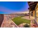 Artificial turf backyard with hot tub and mountain views at 116 Stone Mesa Ct, Henderson, NV 89011