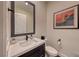 Powder room with single vanity and toilet at 116 Stone Mesa Ct, Henderson, NV 89011